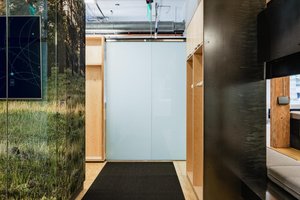Preview of Undead Labs - Image 14: modern, office, open space, wood paneling, glass partition, exposed ceiling, HVAC ductwork, pendant lighting, textured carpet, color, structure wood, railing.