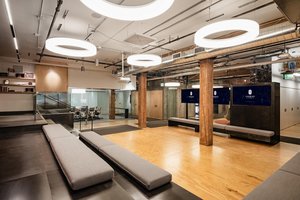 Preview of Undead Labs - Image 9: open floor plan, wood flooring, exposed wood beams, pendant lighting, conference, structure wood, railing, glass partition.