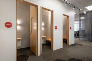 Preview of Undead Labs - Image 18: pivot door, office, interior design, wood, carpet flooring, geometric pattern, modern, frosted glass, neutral colors, lighting, signage.