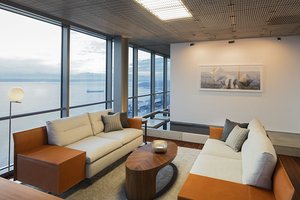 Preview of Zillow Executive Offices - Image 8: Furniture, Indoors, Room, Interior Design, Apartment, Building, Housing, lighting , office, water feature, paver, lighting, wood floor.