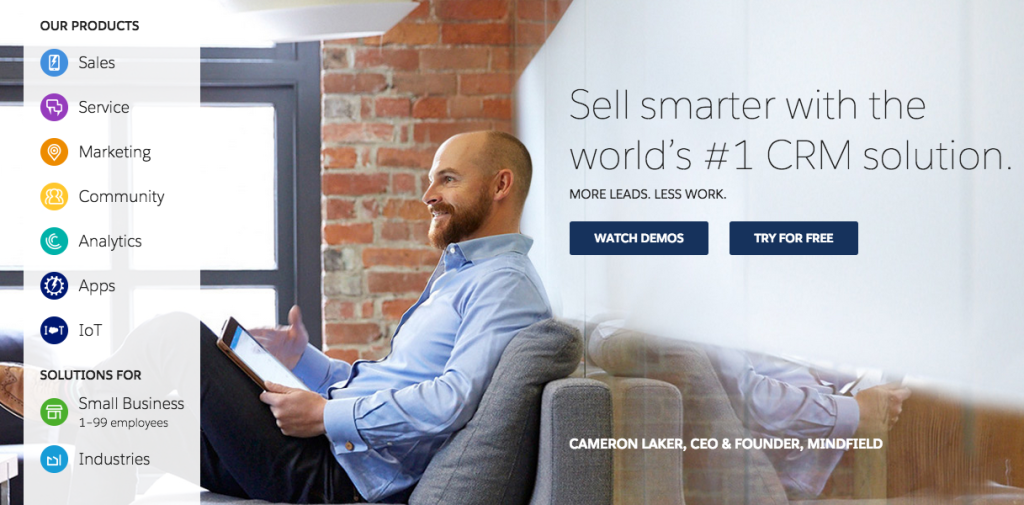 A screenshot of Salesforce.com's website. The website features a large picture of Salesforce.com's CEO and founder. Over the photo on the right hand side are the words "Sell smarter with the world's number one CRM solution. More leads, less work." Below that are buttons to watch demos and to try the product for free.