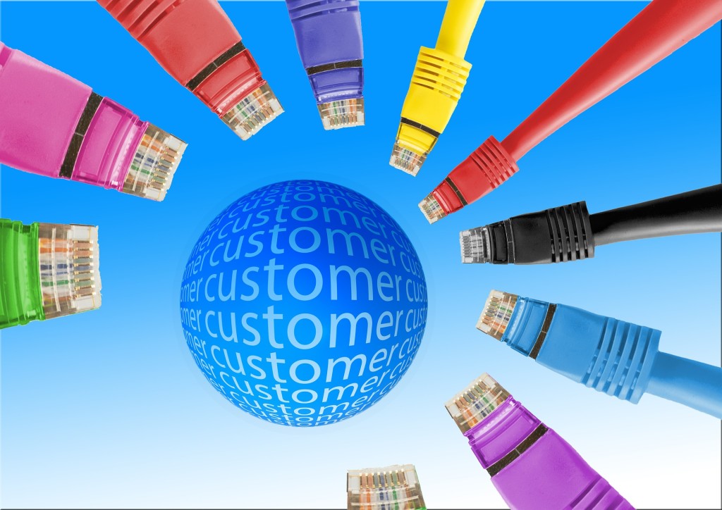 A circle in the center with the word &quot;customer&quot; repeated across it; the circle is surrounded by nine computer cables of various colours.