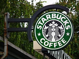 Photo of a Starbucks storefront sign.