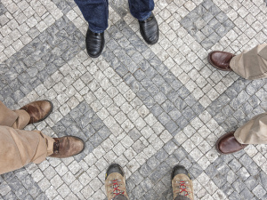 Four sets of feet on pavers