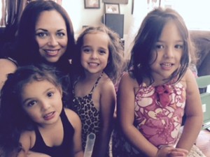 Picture of instructor with her three daughters