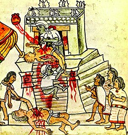 An illustration shows an Aztec priest cutting the beating heart out of a sacrificial victim on the top of the steps of a temple. The heart rises from the victim's chest toward the sun. A previous victim is shown lying at the foot of the temple, surrounded by several onlookers.