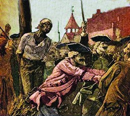 An illustration shows a black man tied to a stake with kindling aflame at his feet; white soldiers holding guns push back a watching crowd.