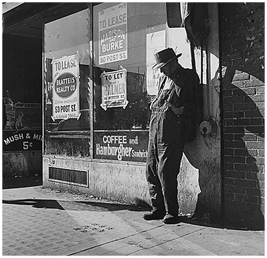 A photograph shows an elderly destitute man leaning against a vacant storefront in San Francisco, California. The window is covered with signs indicating various properties that are 