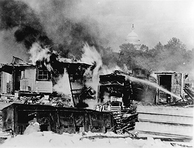 A photograph shows the burning of veterans' camps at Anacostia Flats.