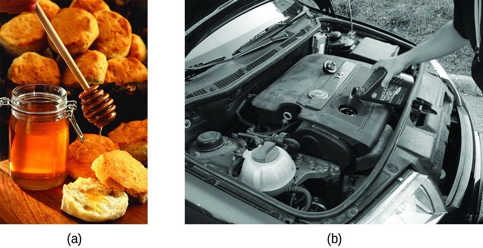 a) is a photo of honey being put on a biscuit.  b) is a black and white photo of a person adding motor oil to a car engine. 