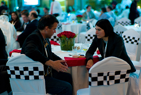 A photograph shows two people making eye contact during a conversation.c