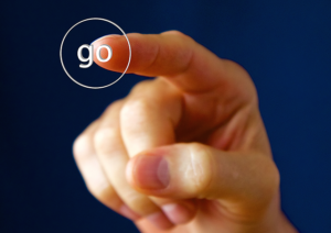 Finger pushing go button.