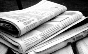 Folded newspapers in a pile