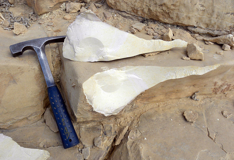 A geologist's hammer used to break up rocks, as well as a scale in the photograph