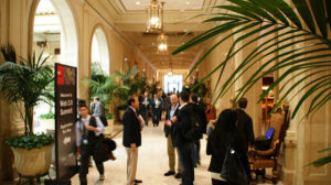 An image of networking at a conference.