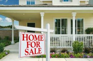 A house with a sign in front of it that says Home for Sale