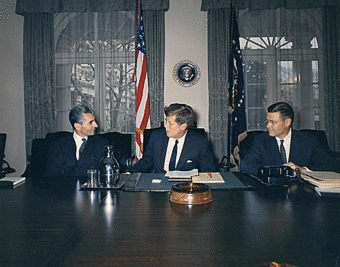 A photo of the Shah of Iran with John F. Kennedy and Robert McNamara in 1962 in a White House office.