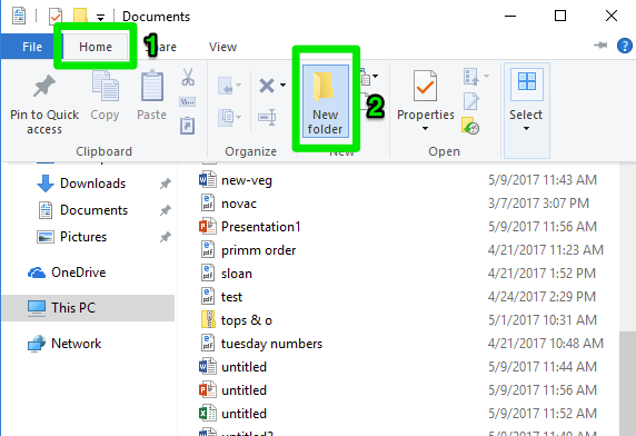 een file finder venster wordt geopend specifiek op de startpagina. Er is een groene 2 die aangeeft waar de optie om een "nieuwe map" in Windows 10 is.