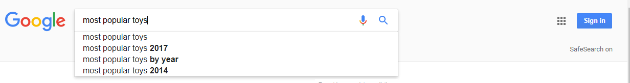 The Google search engine is open, with a search for, "Most popular toys 2017" entered in the search box. Instant search results are displayed.