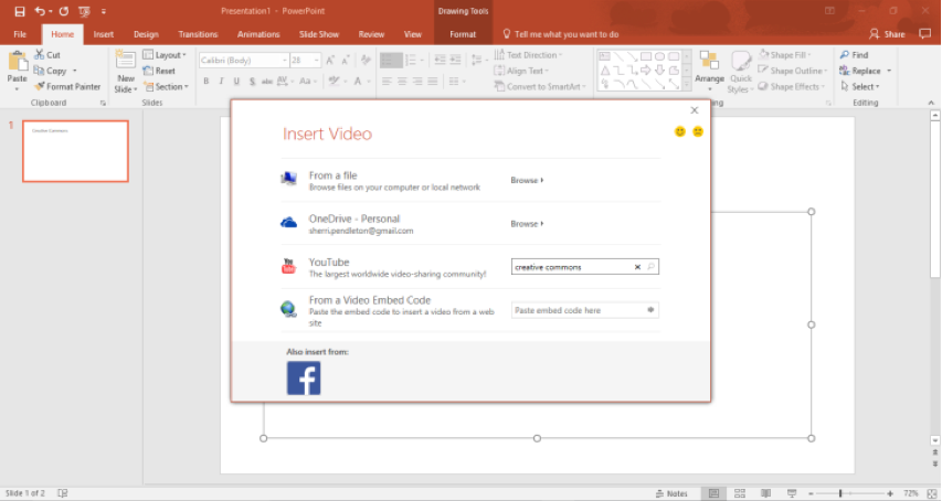 A Microsoft powerpoint is open. A insert video dialog box has opened with four options. The third option down is to search on youtube. In the youtube search section creative commons has been entered. 