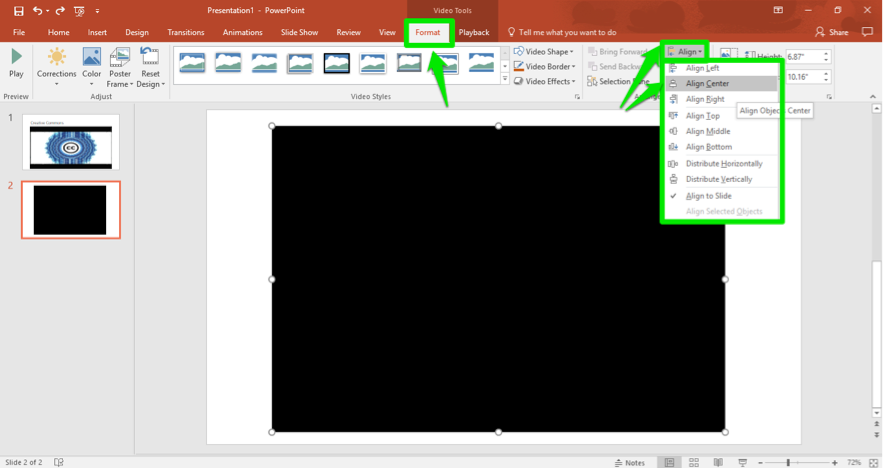 A Microsoft powerpoint is open. A video has been inserted. There are three green arrows on the slide, the first one is pointing at the format tab in the ribbon menu. The second is pointed at the align button and the third shows that the video is set to be aligned to the center.