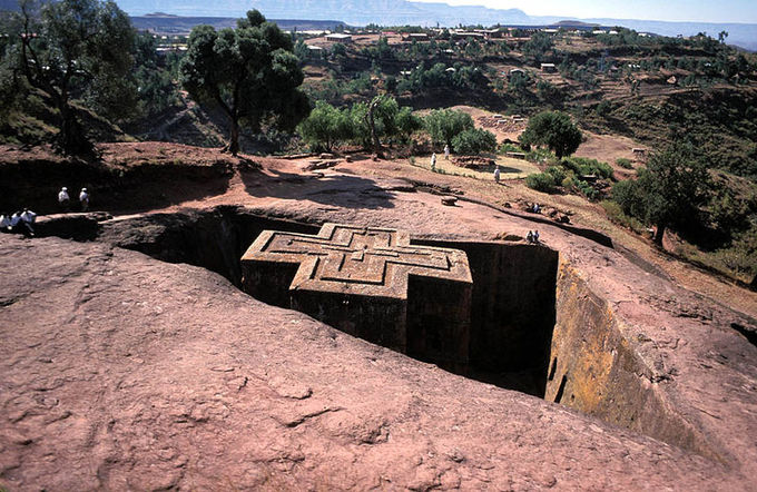 View of the church from above shows a large cross cut from rock.