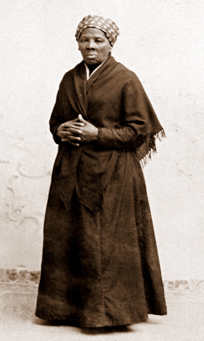 Photograph of Harriet Tubman standing with her hands crossed