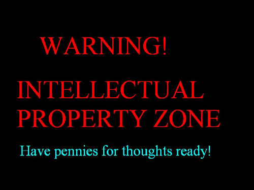 A message is written in red and blue on a black background. It says: WARNING! INTELLECTUAL PROPERTY ZONE. Have pennies for thoughts ready!