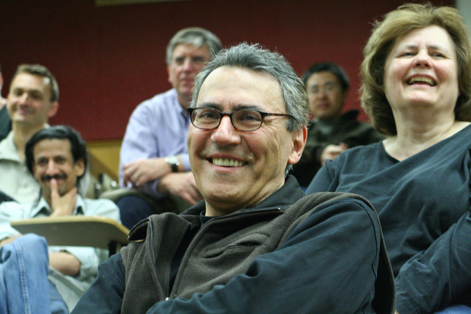 A picture of an audience smiling.