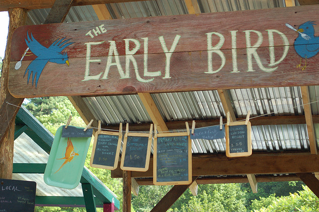 A picture of a sign that says "the early bird."