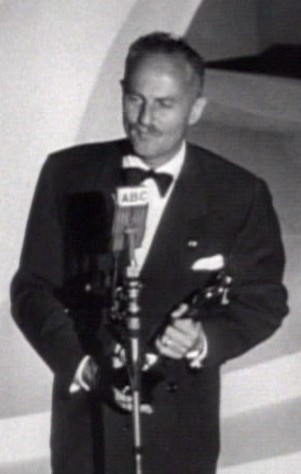 American film producer Darryl F. Zanuck accepts an Academy Award for his work.
