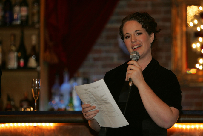 A woman in a wedding party gives an after-dinner speech.