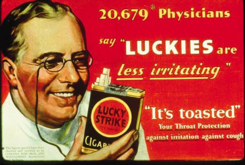 Lucky Strike cigarette ad featuring a picture of a doctor holding a pack of cigarettes. It reads, "20,679 physicians say 'Luckies are less irritating.' 'It's toasted.' Your throat protection against irritation against cough". 