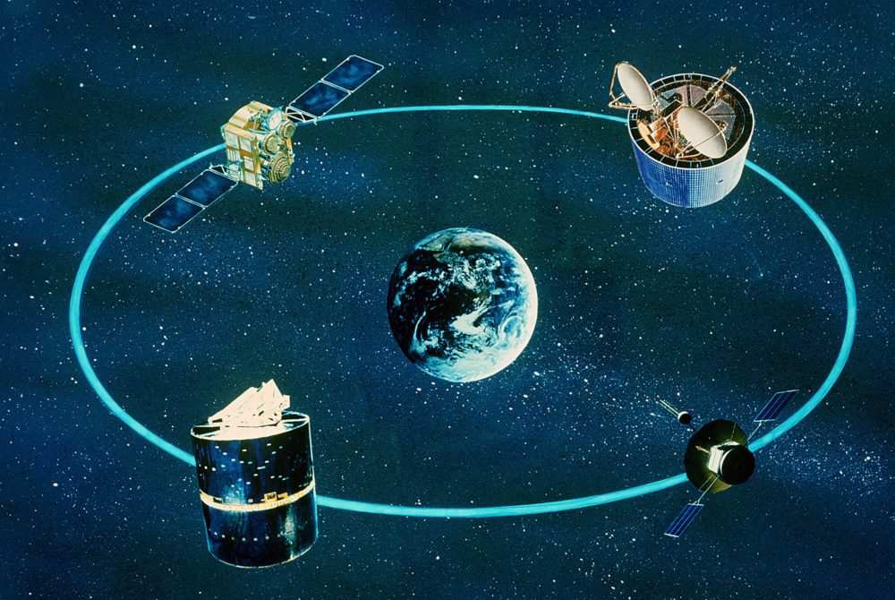 An artist’s concept of various communications satellites in orbit; 11/23/1981. There are four different looking satellites all shown circling the Earth.