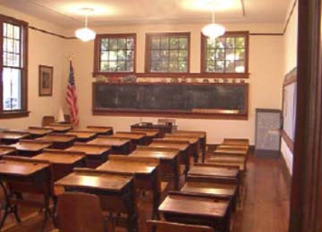 A traditional classroom setting with orderly class rows.