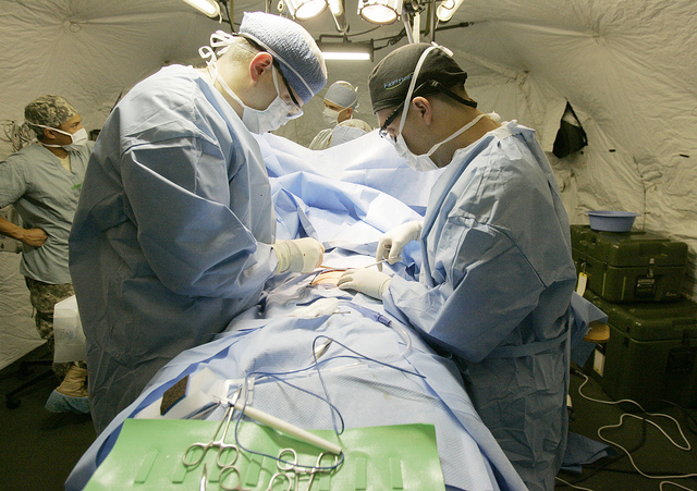 Doctors treating a patient in Surgery