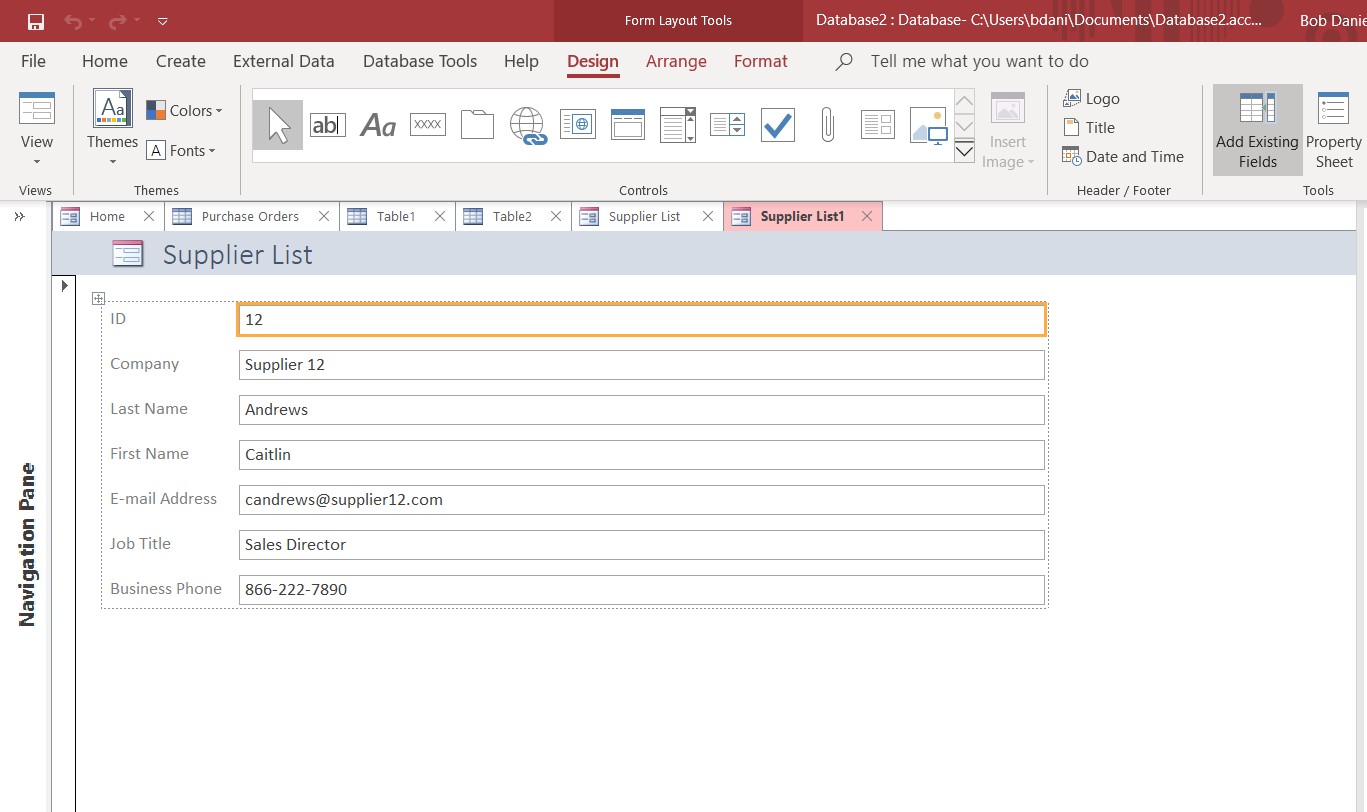 Microsoft Access form open. "Design" is selected in the toolbar and the form includes the following fields: ID, Company, Last Name, First Name, e-mail address, Job Title, business phone.