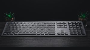 A keyboard sitting on a desk