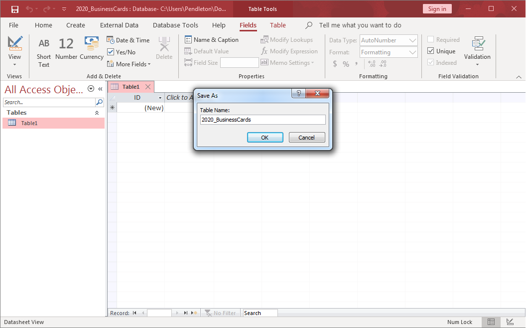 A blank database in Microsoft Access. A Save As dialog box is open, and a new table called 2020_BusinessCards is being created.