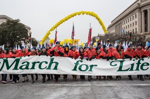 WASHINGTON, DC - JANUARY 25: Anti-abortion protesters attend the March for Life on January 25, 2013 in Washington, DC. The pro-life gathering is held each year around the anniversary of the Roe v. Wade Supreme Court decision.