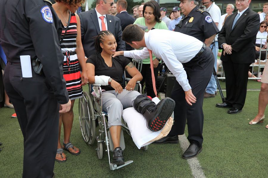 Photo of House Speaker, Paul Ryan, at the 2017 congressional charity baseball game taking a moment to honor one of the capitol police officers who saved lives.