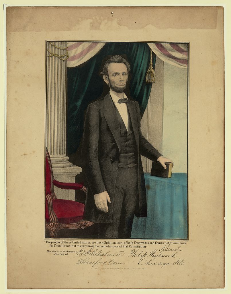 Three-quarter portrait of Abraham Lincoln standing, holding a book, facing right--1809-1865