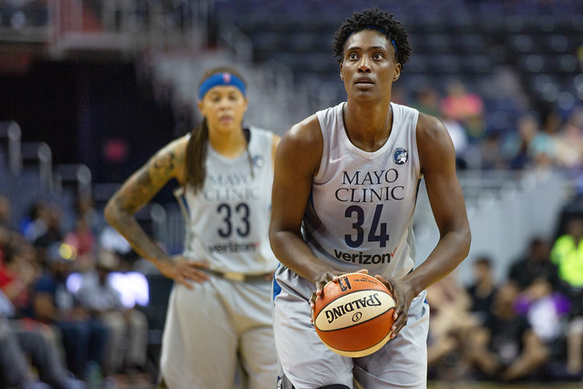 Basketball player Sylvia Fowles prepares to take a free throw. 