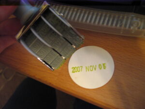 A piece of paper is stamped with the date 2007 November 05. 