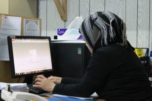 Woman in a hijab working on a computer