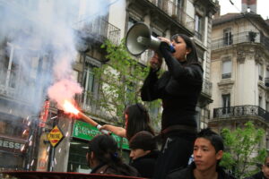 A woman shouting into a megaphone.