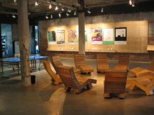 An event space with a ping-pong table and chairs in a circle