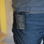 Lavalier battery pack clipped to a pocket