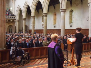 A woman giving a eulogy in a church