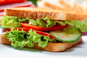 A lettuce, tomato, and cucumber sandwich.